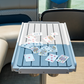 Table with playing cards on a boat with water in the background